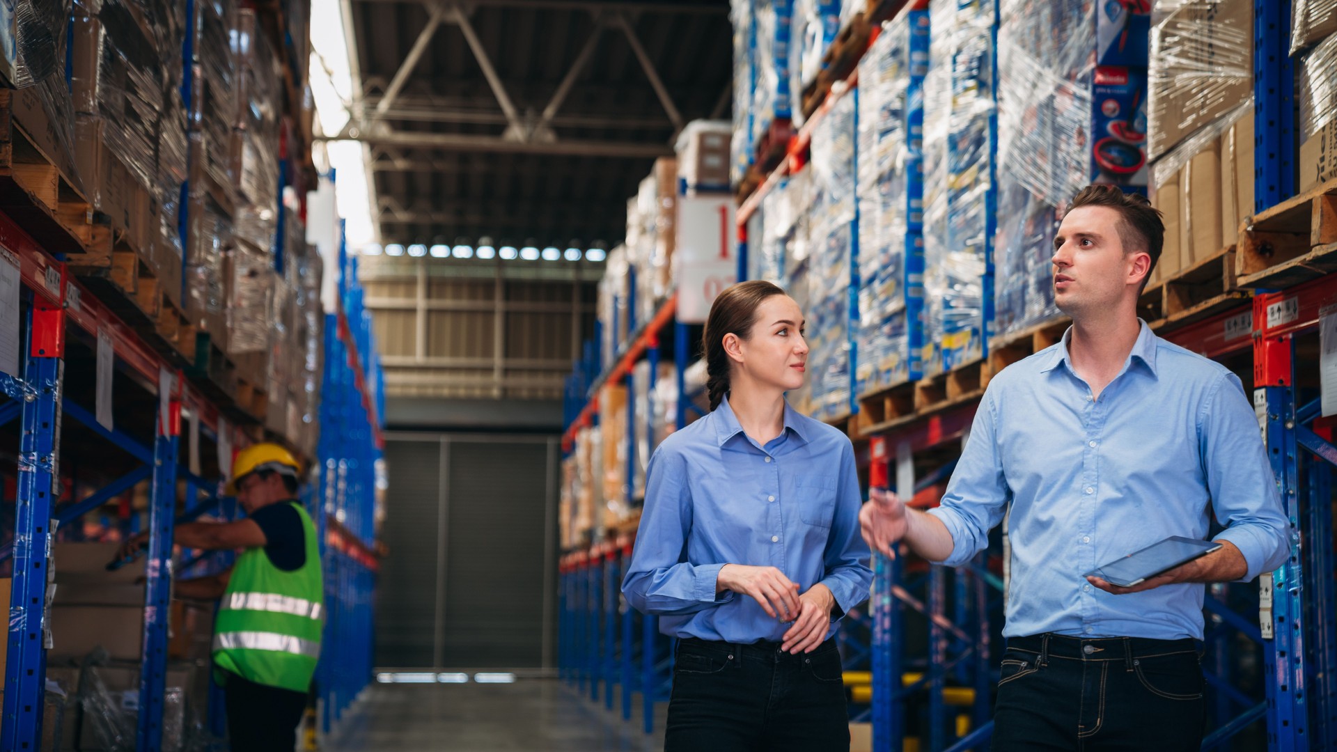 Warehouse worker working and checking the stock in the warehouse. 
Factory manager using digital tablet check barcode in industry factory logistic.