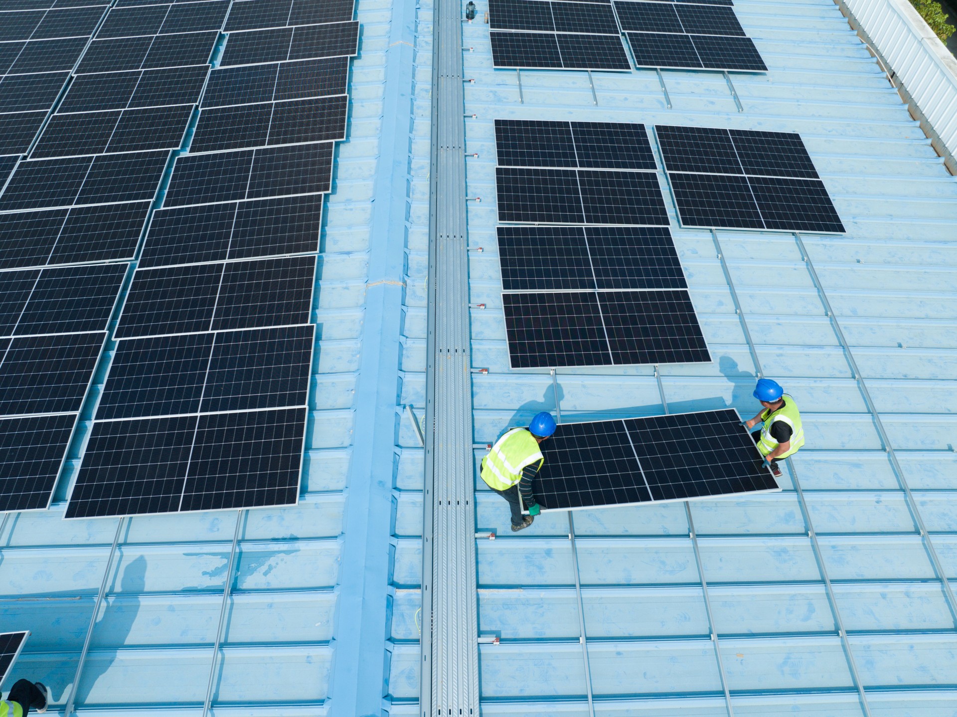 Workers are moving solar panels